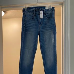 No rips, American Eagle blue jeans. Never worn once